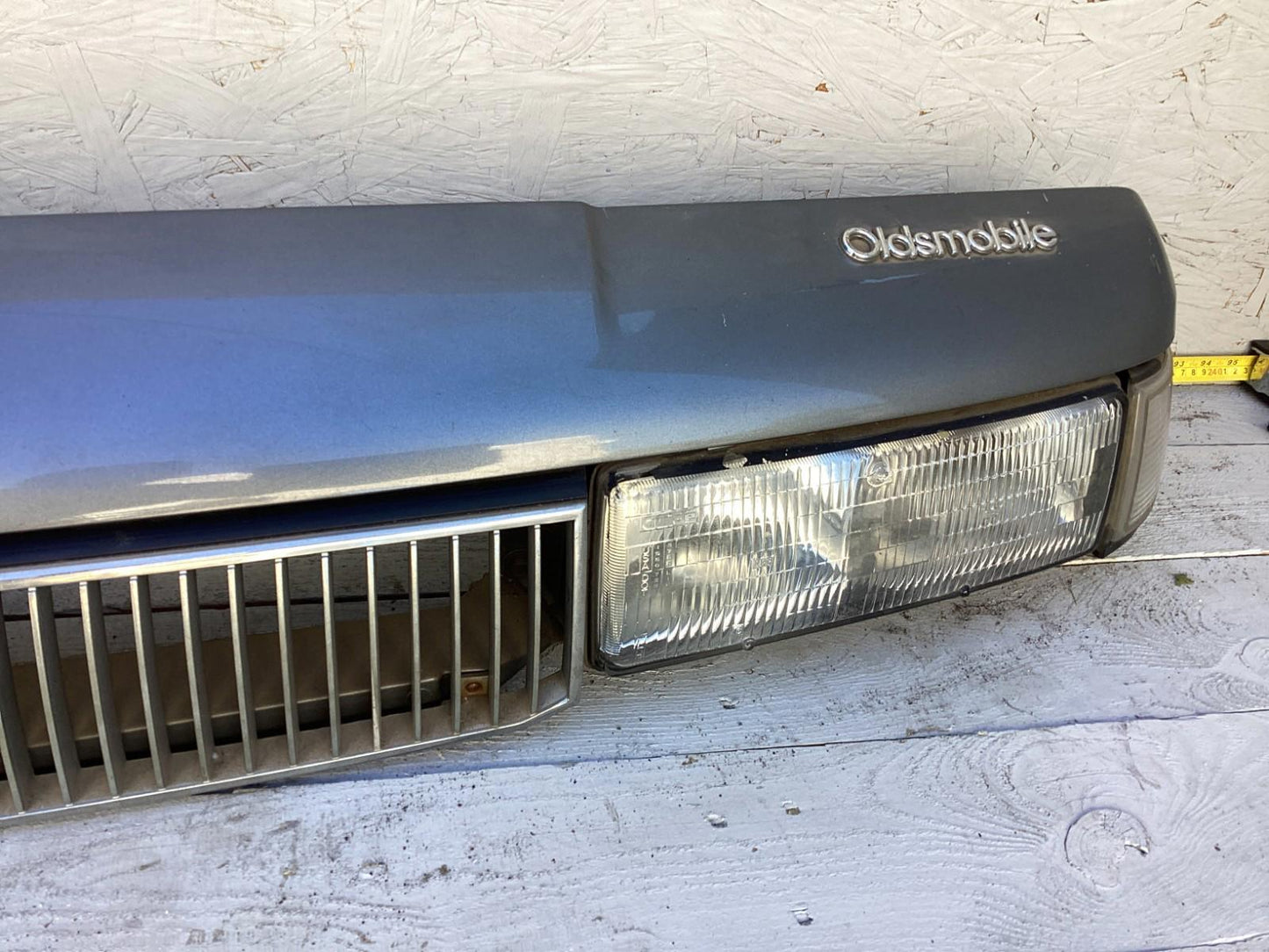 1987-1996 Oldsmobile Cutlass Ciera Front Headlight Header Panel 10068954 OEM