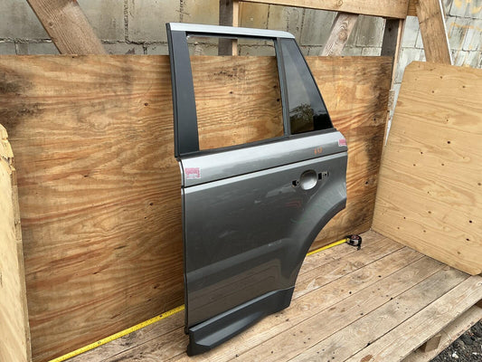 2006 - 2009 Land Rover Range Rover Sport Rear Left Driver Side Door Shell OEM.