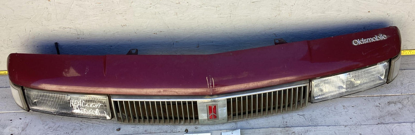 1987-1996 Oldsmobile Cutlass Ciera Front Headlight Header Panel 10068954 OEM