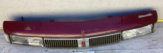 1987-1996 Oldsmobile Cutlass Ciera Front Headlight Header Panel 10068954 OEM