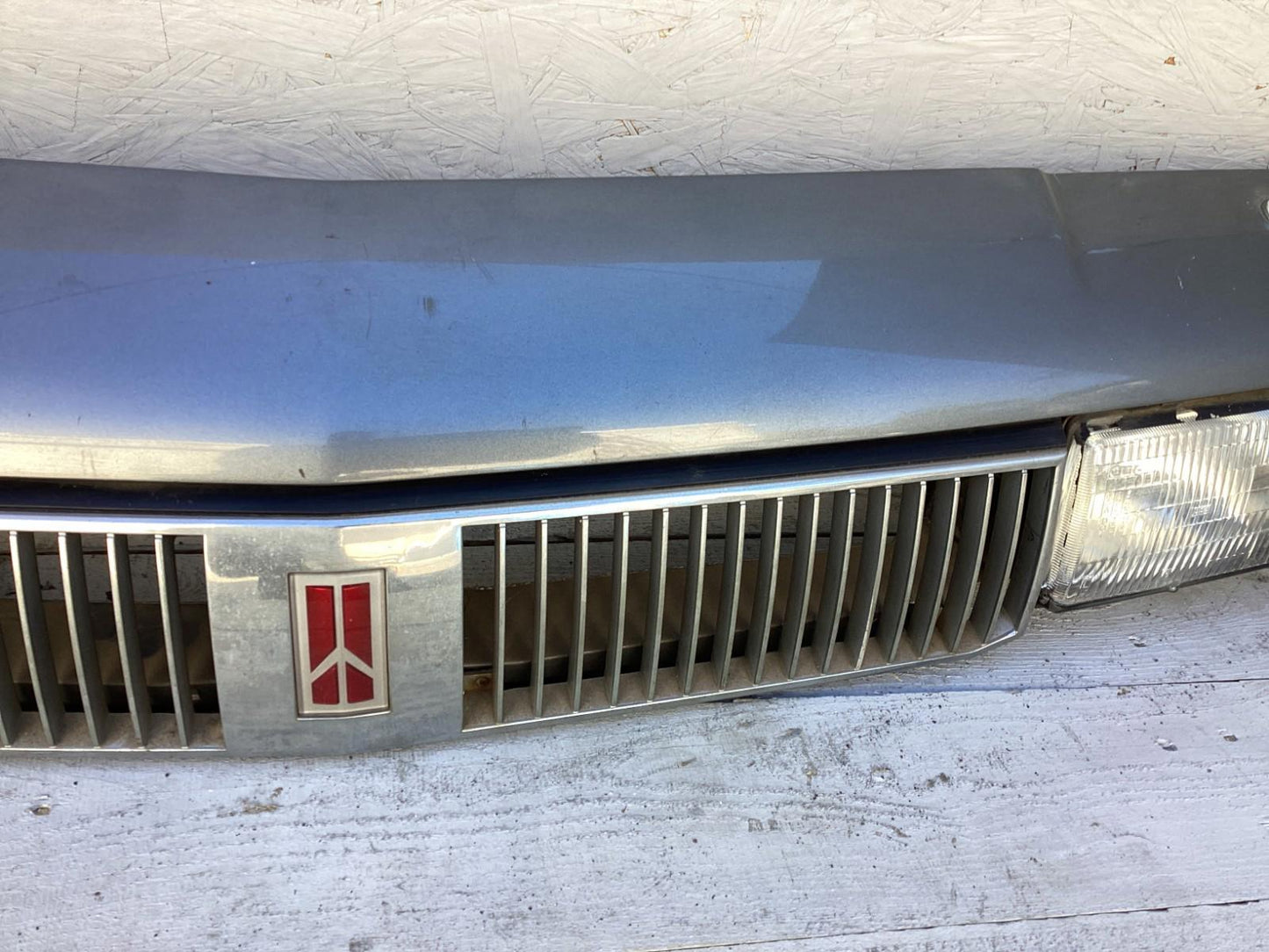 1987-1996 Oldsmobile Cutlass Ciera Front Headlight Header Panel 10068954 OEM