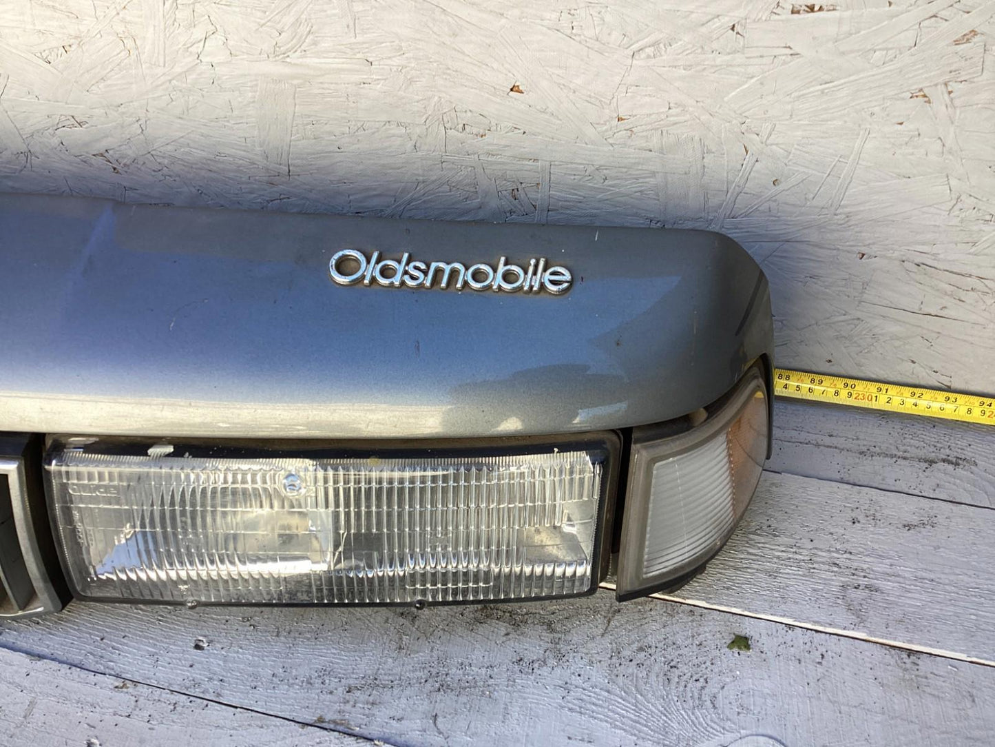 1987-1996 Oldsmobile Cutlass Ciera Front Headlight Header Panel 10068954 OEM