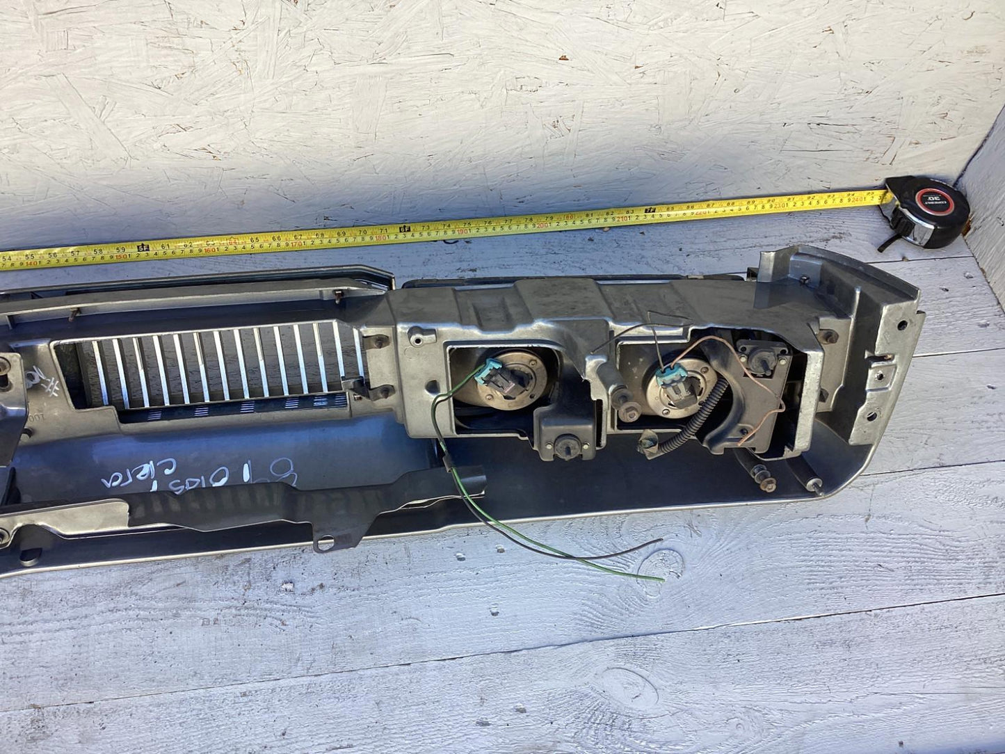 1987-1996 Oldsmobile Cutlass Ciera Front Headlight Header Panel 10068954 OEM