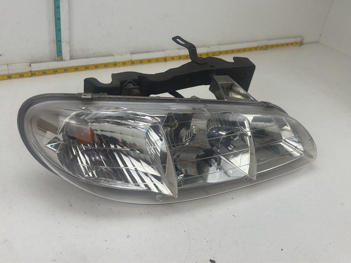 1996-1998 Pontiac Grand AM Front Right Passenger Side Headlamp Light OEM